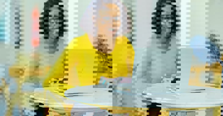 Woman working on laptop photo credit Moses Londo 