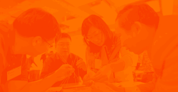 Orange duotone people working at table