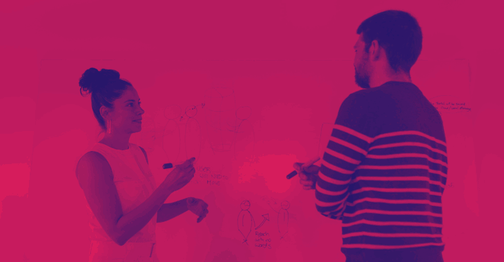 Engineers Discuss Designs In Front Of Whiteboard Pink Duotone